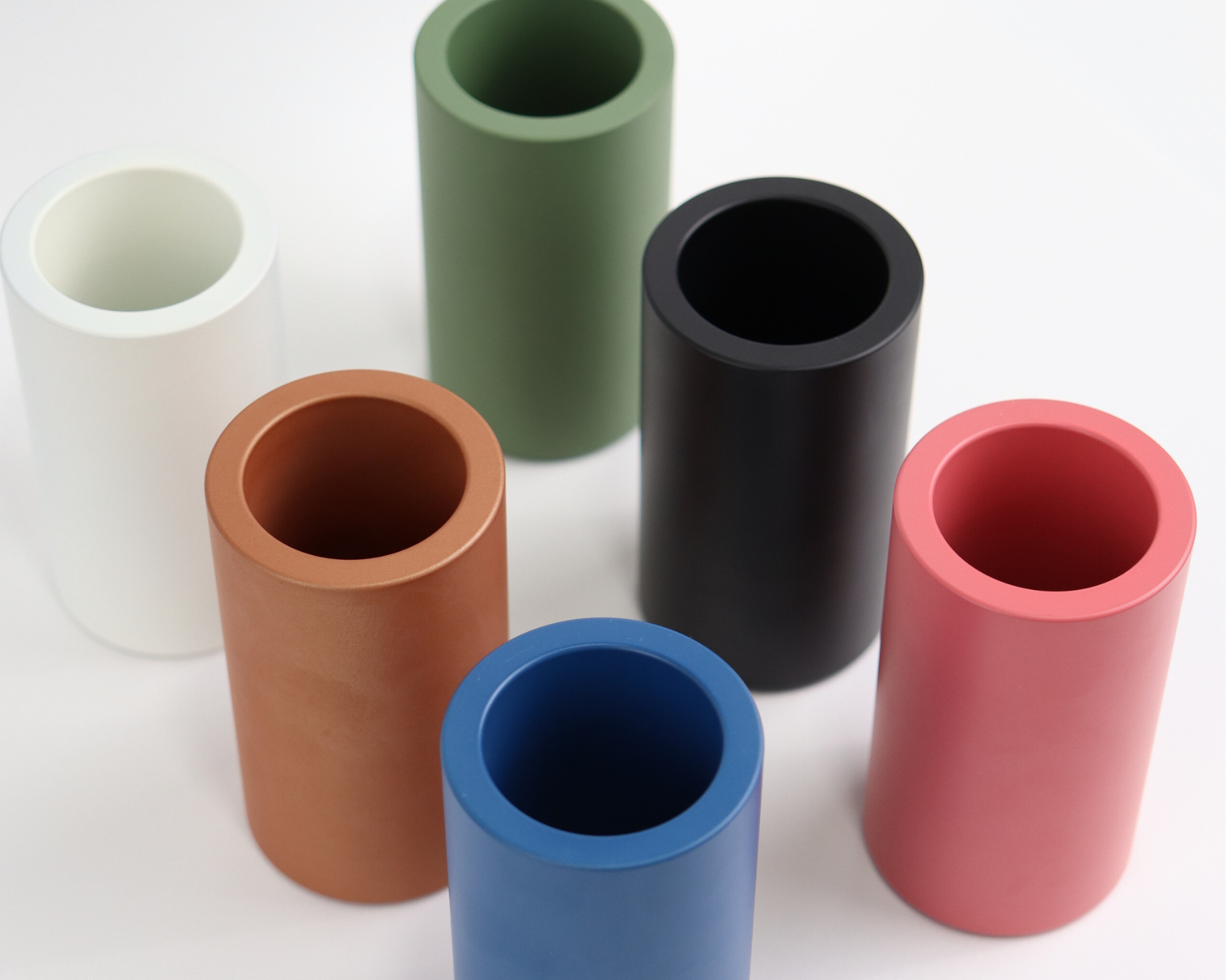 Assorted ROUS Alabaster Bathroom Organizers in mid-century modern colors: olive, polo, charcoal, snow, copper, and rose pink.