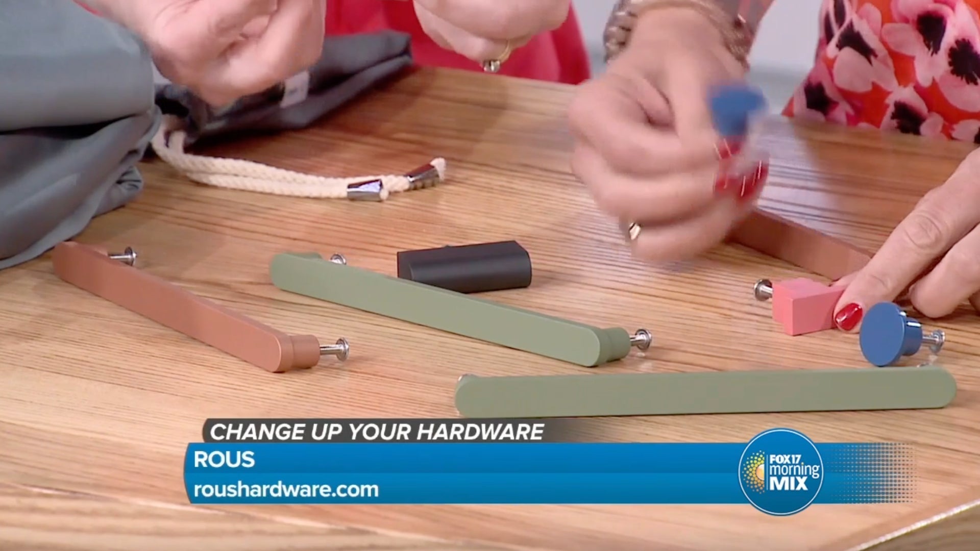 Fox 17 hosts handling ROUS colorful handles on a news segment.