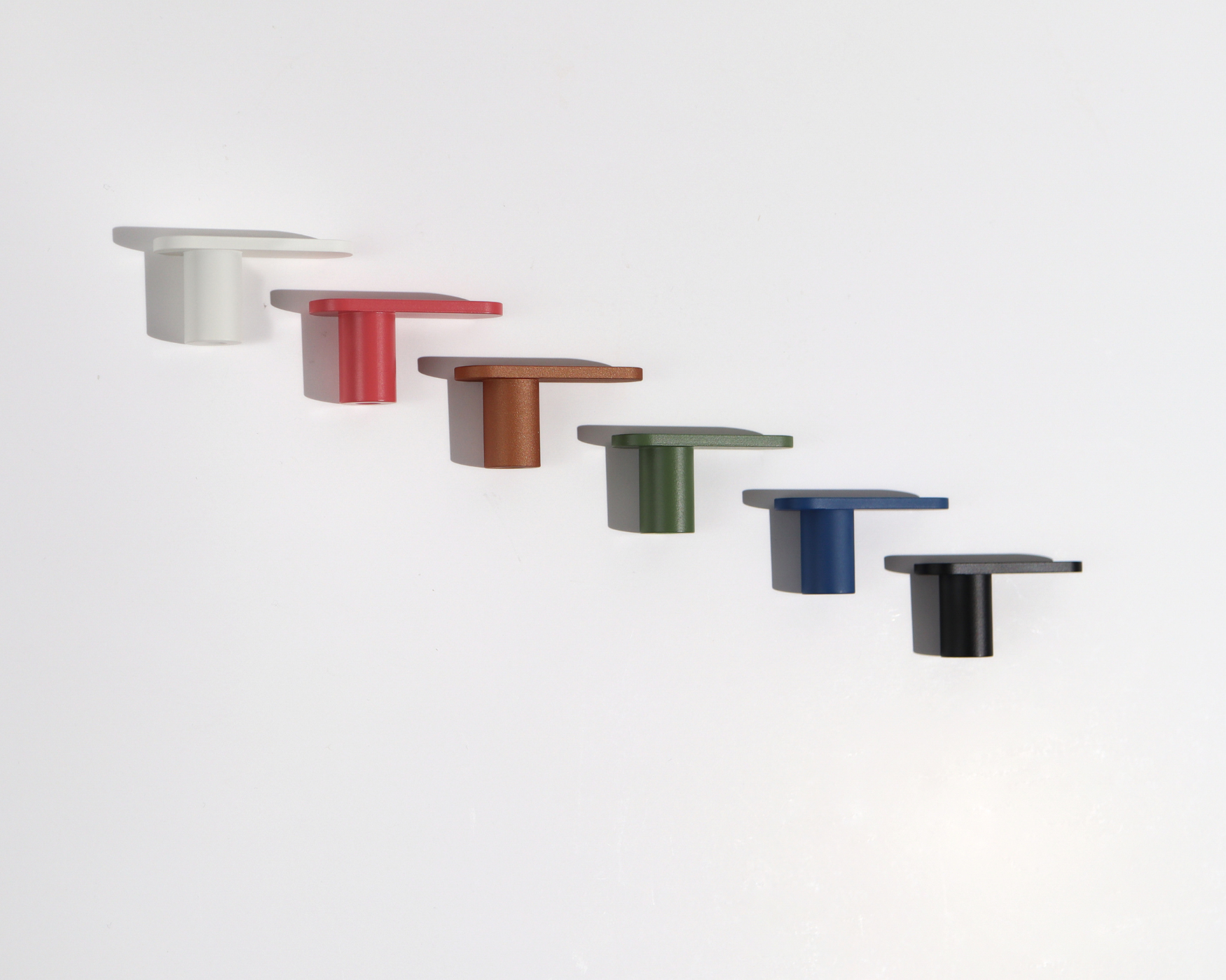 Six different Mid-Century Modern L-Bar Shaped Knobs in various colors including white, red, copper, green, blue, and black