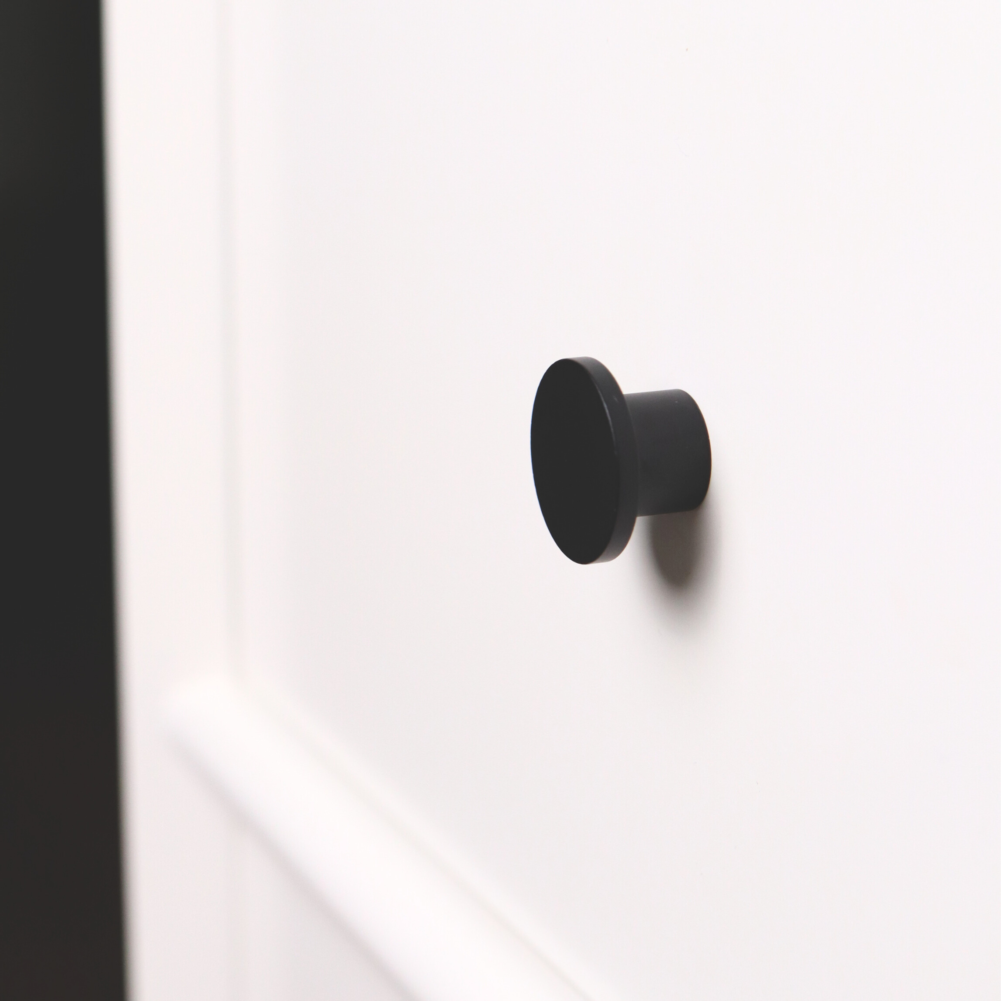 Black mid-century modern round knob