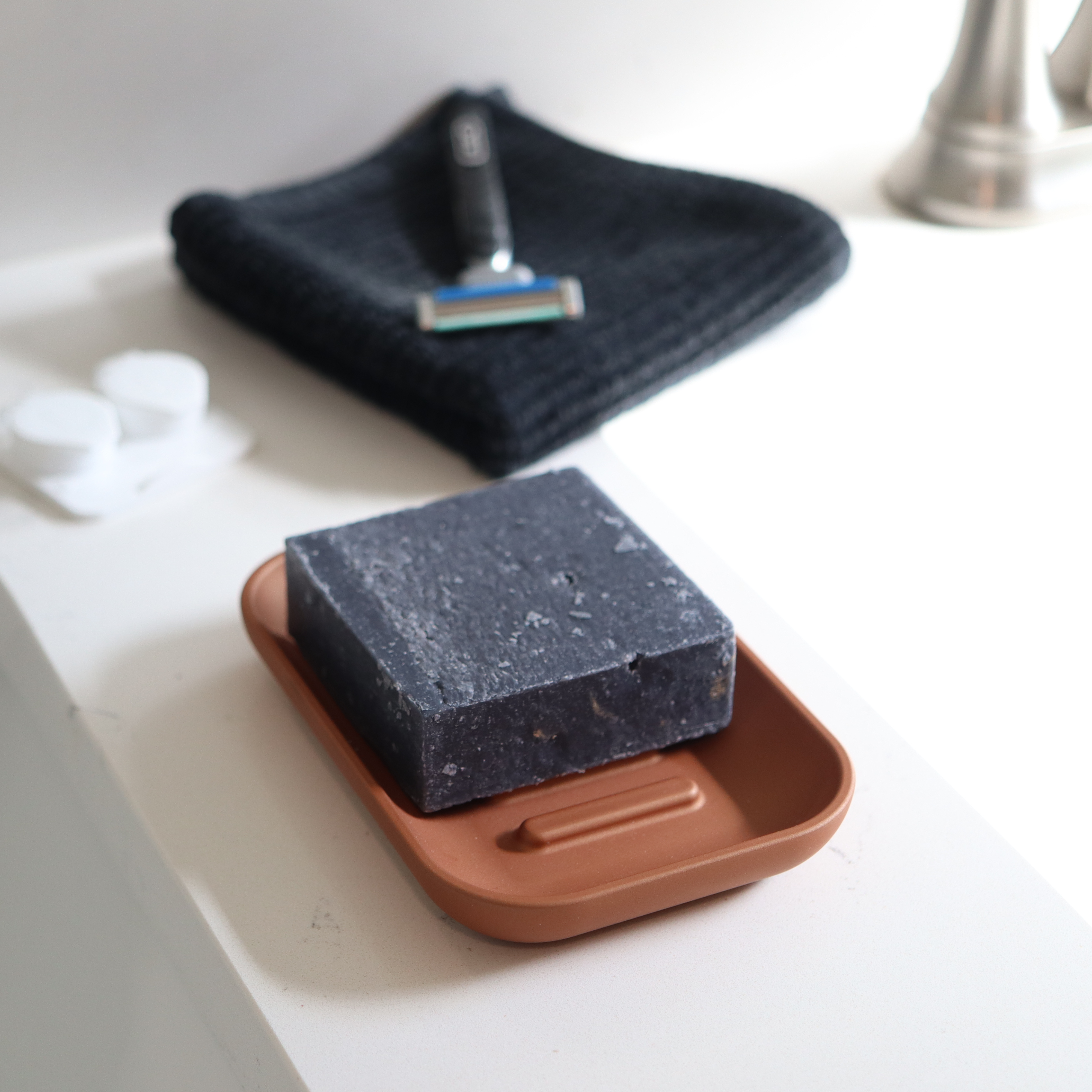 Copper colored soap dish for shower