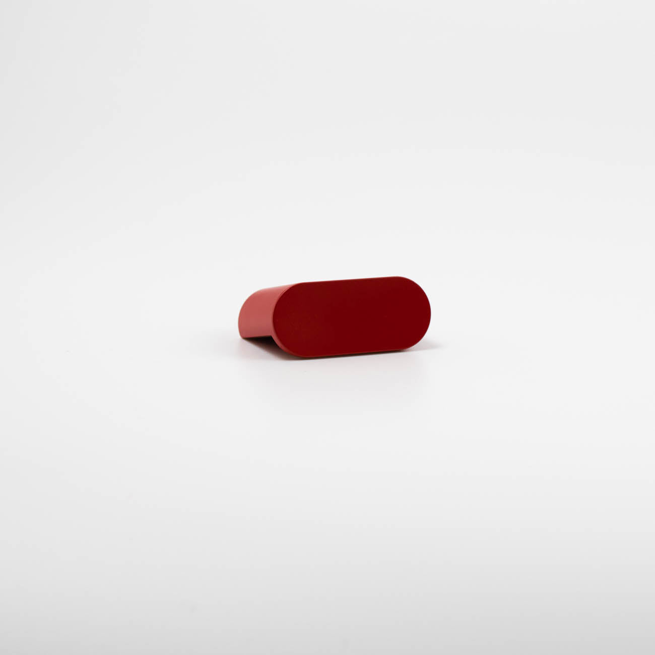 Red oval cabinet knob