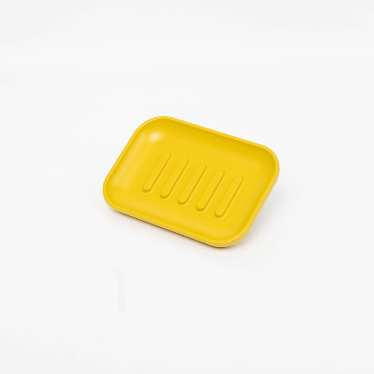Yellow colored shower soap dish