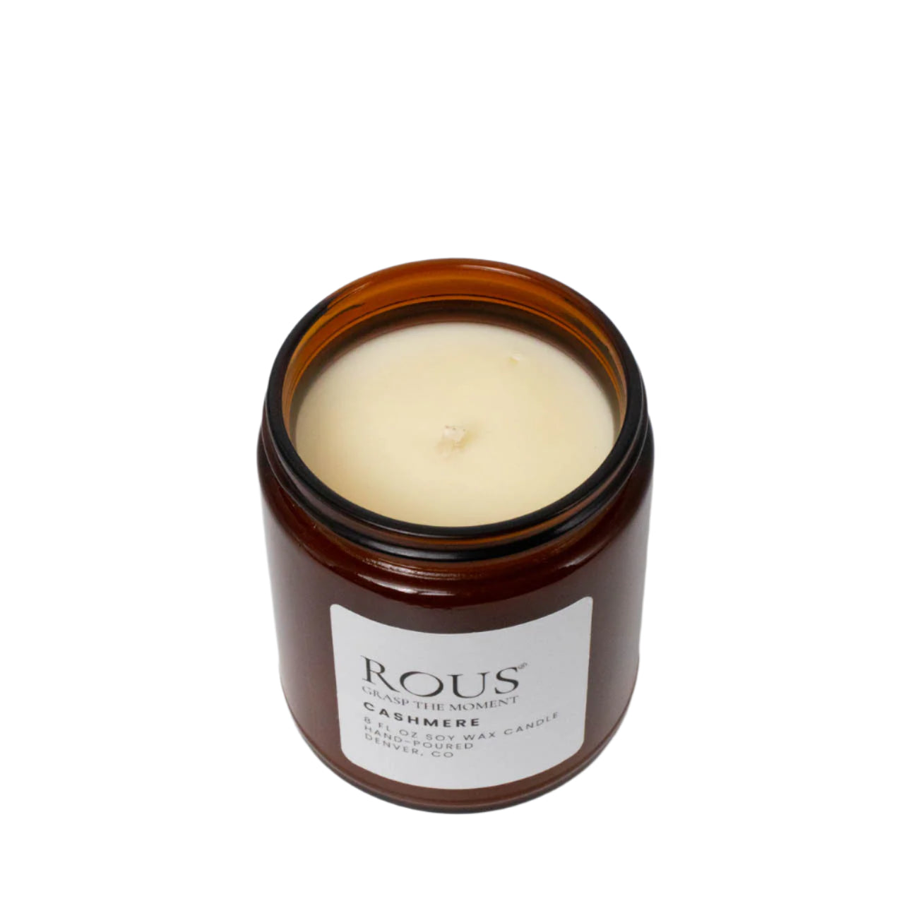 A lemon and saffron soy candle named Cashmere, we are looking at the clean burning wick.