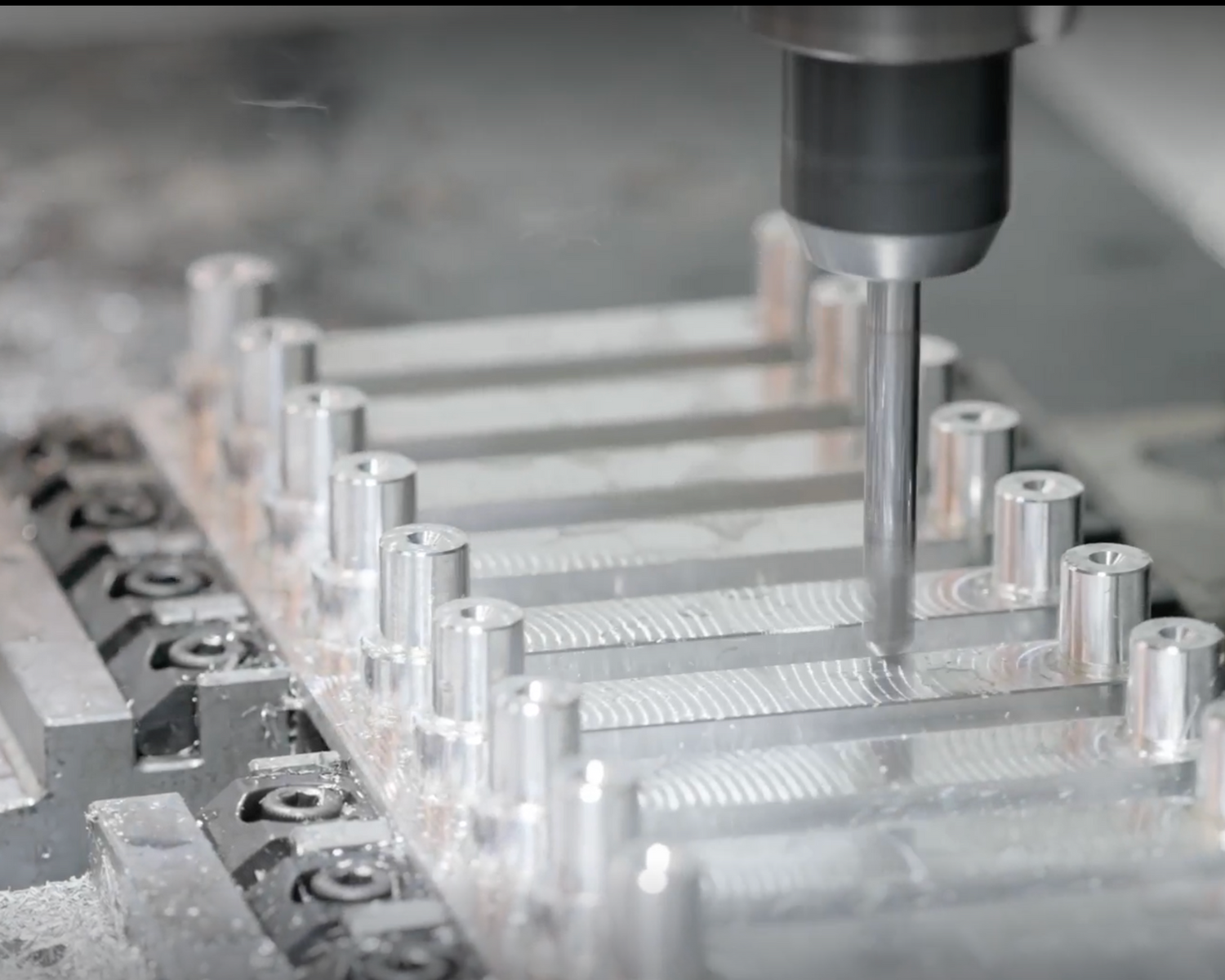 Close-up of a CNC machine cutting and shaping aluminum, showcasing precision craftsmanship for high-quality cabinet hardware.