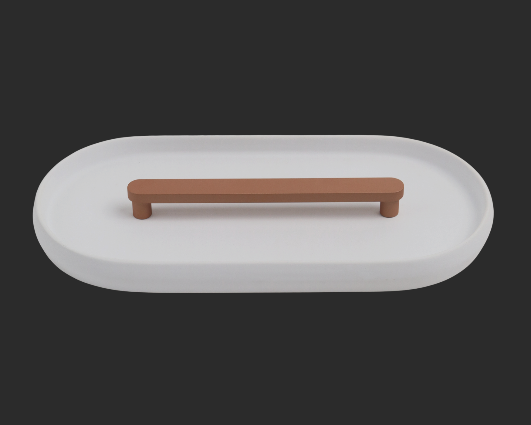 Modern copper cabinet T-bar handle on a minimalist white tray background.