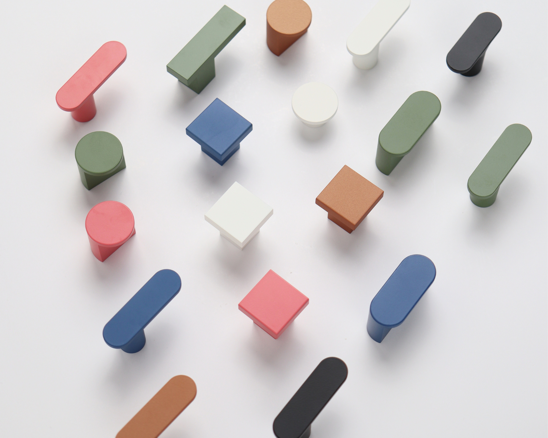Colorful of modern cabinet hardware knobs in various shapes and style, displayed on a white background
