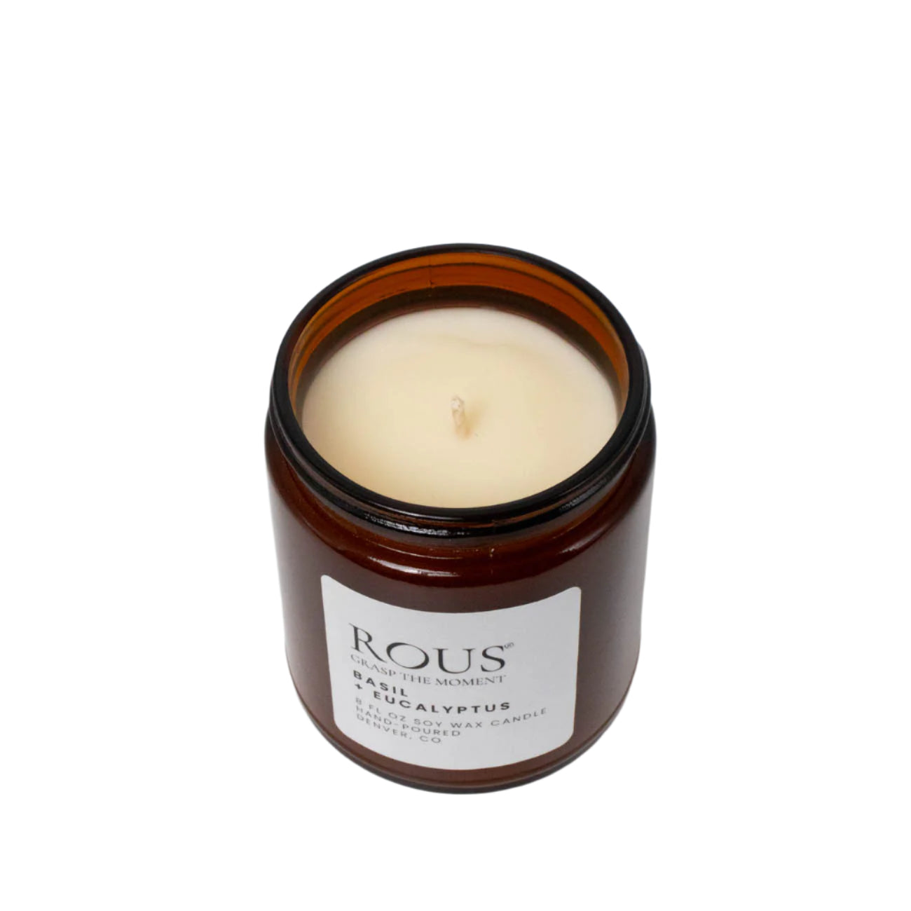 View of the wick in a clean-burning basil and eucalyptus scented soy candle. 